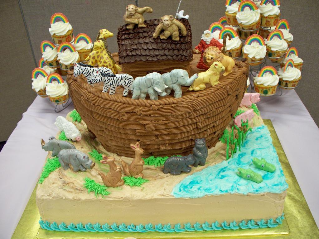 Cake in Shape of Noah's Ark with Accompanying Cupcakes