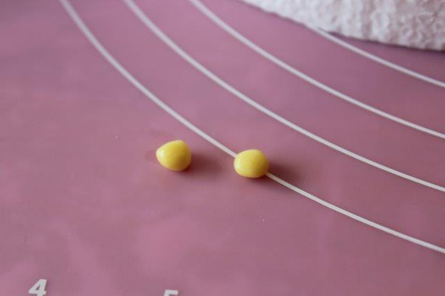 Two Small Yellow Modeling Chocolate Balls