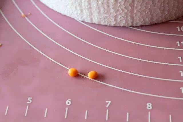Two Small Orange Modeling Chocolate Balls