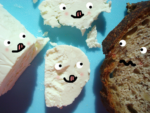 Pieces of Goat Cheese and Bread with Cartoon Faces