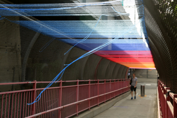 Pedestrian Bridge with Multicolored Yarn Overhanging