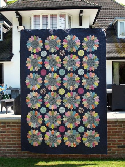 Large Dresden Plate Quilt Hanging Outside of House