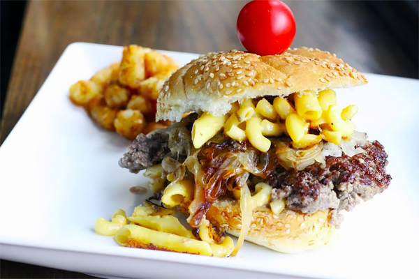 Burger Topped with Mac and Cheese, Cherry Tomato on Top