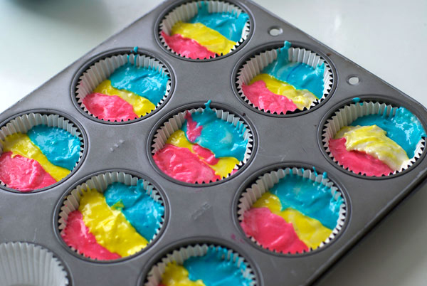 Colorful Batter in Cupcake Tins, Ready to be Baked