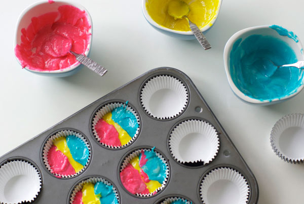 Top View of Vibrant Batter in Cupcake Tins, Batter in Bowls