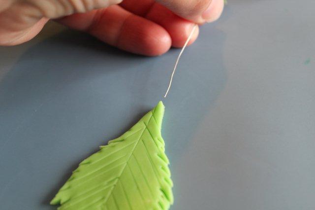 Holding Modeling Chocolate Leaf