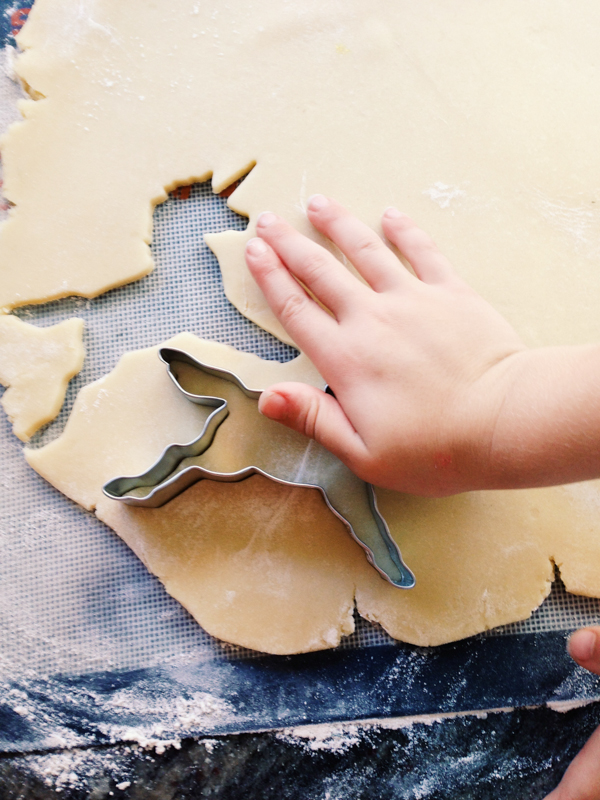 Cookie Dough Rolled Out, Being Cut into Unicorn Shapes by Little Girl