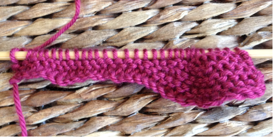 Knit Pink Yarn on Knitting Needle