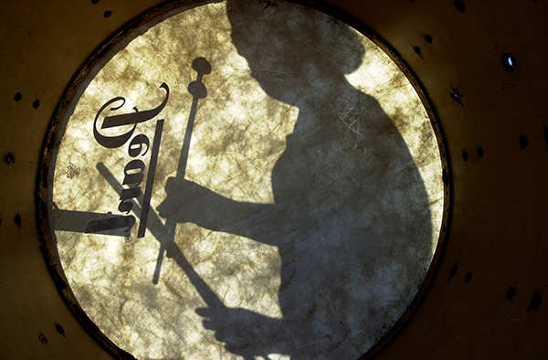 Silhouette of Drummer Through the Skin of a Drum