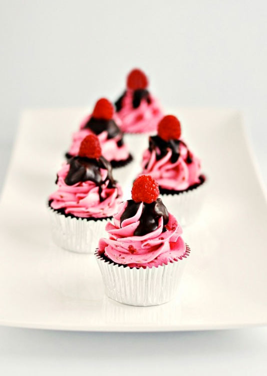 Raspberry Cupcake with Pink Icing, Chocolate Sauce and Raspberry Toppers