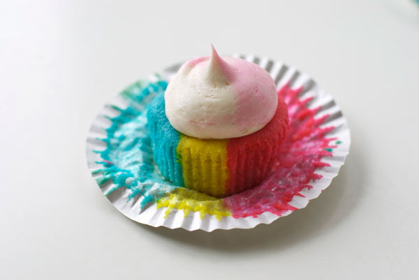 Rainbow-striped Cupcake with Dollop of Frosting