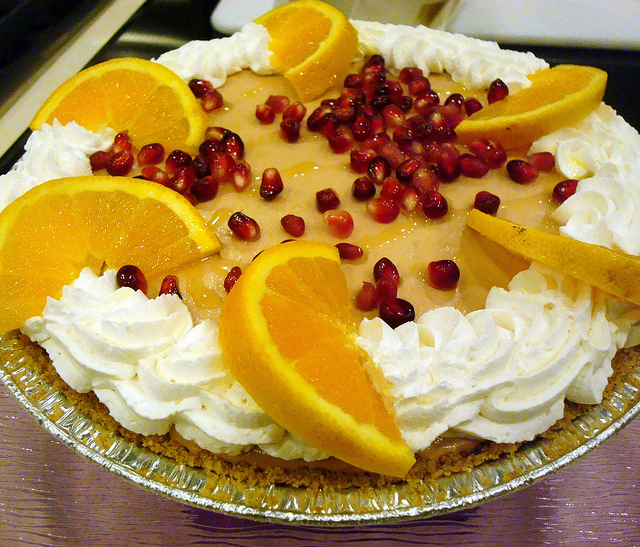 Pomegranate Mouse Pie with Whipped Cream and Oranges 