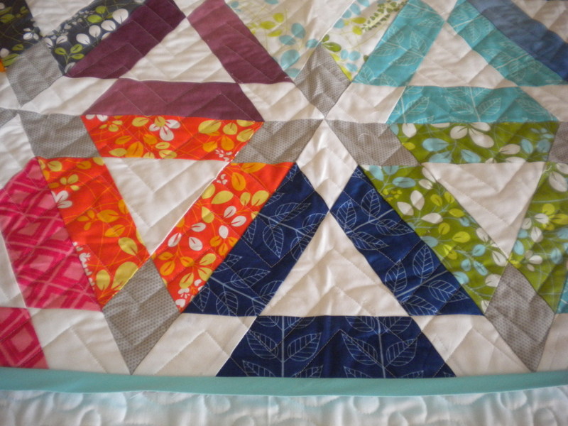 Quilt with Patterned Triangle Design