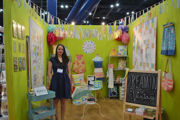 Woman At Booth At International Quilt Market 2013