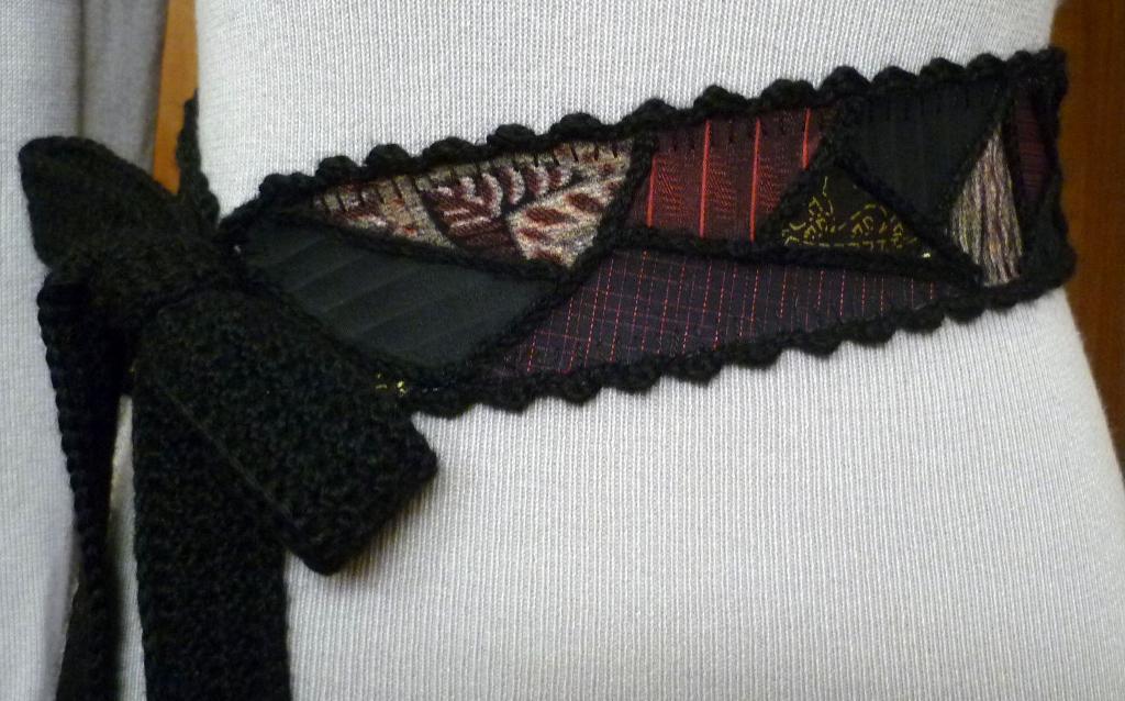 Crocheted Black and Patterned Belt on Mannequin 