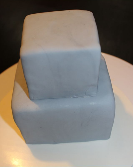 Two Square Cake Tiers Covered in Modeling Chocolate