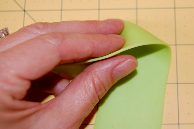 Hand Rolling out Green Fondant