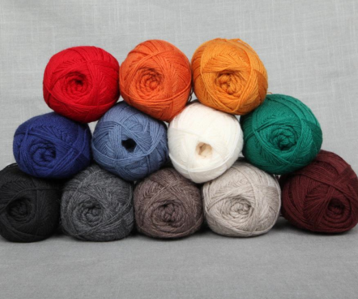 Stack of Different Colored Lamb's Pride Yarn 