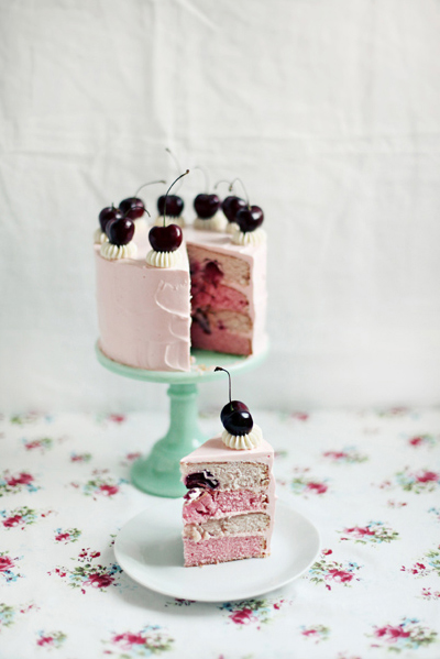 White Cherry-Topped Cake with Piece Out