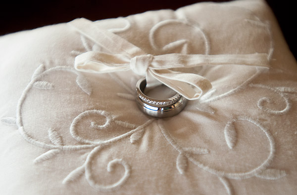 Shot of Wedding Ring on a White Pillow