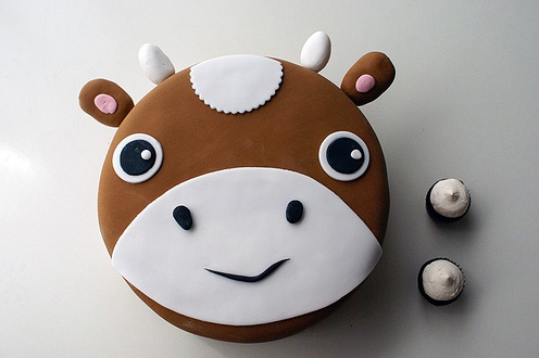 Cow Cake with Accompanying Cupcakes