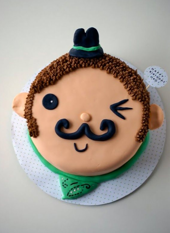 Cake Decorated as Mustached Man's Face