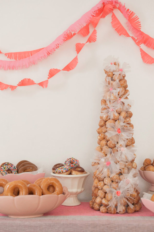 Table with Doughnut-hole Cake and Doughnuts