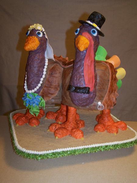 Cake Carved as Girl and Boy Turkeys