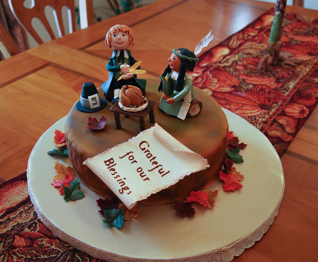 Cake Topped with Fondant Pilgrim and Native American