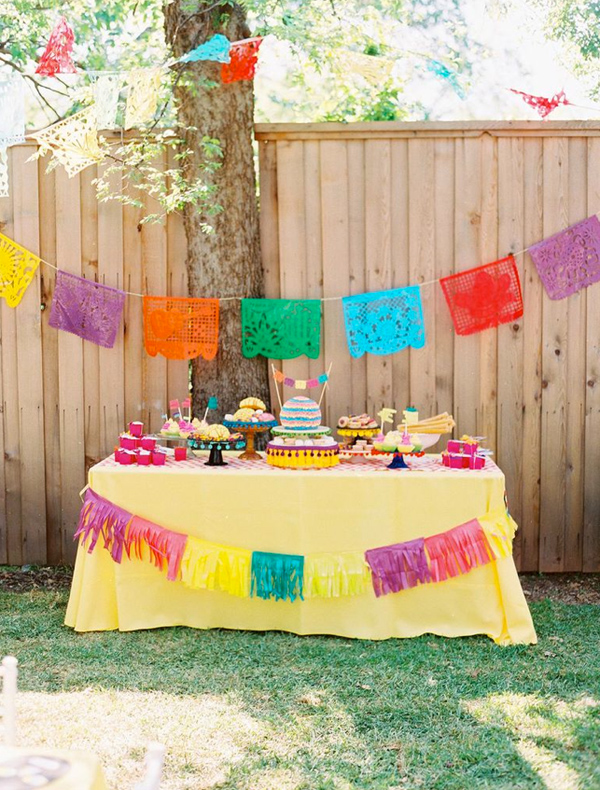 Outdoor Fiesta Dessert Table with Colorful Flags