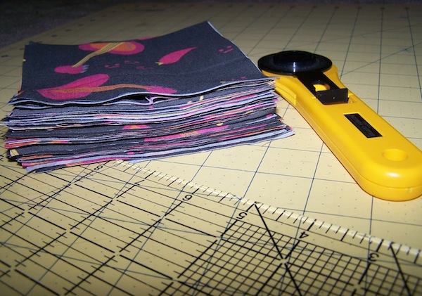 Cutter and Fabric Stack on Gridded Surface