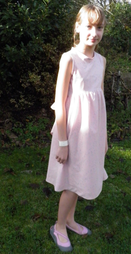 Young Girl Wearing Handsewn Dress 