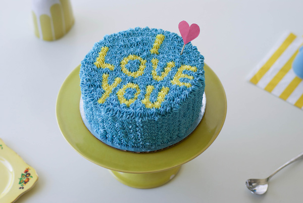 Blue Piped Cake Reading "I Love You"