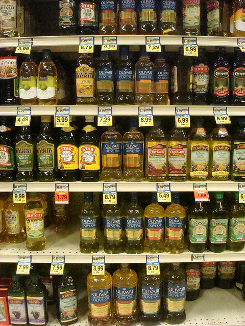 Rows on Bottles of Olive Oil on Store Shelves