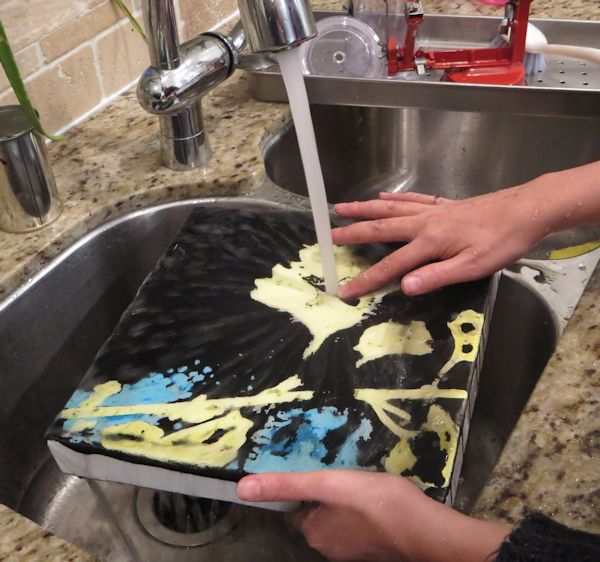 washing off ink in the sink