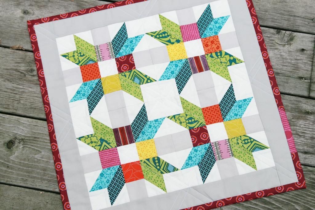 Mini Quilt with Colorful Poinsettia Design - www.craftsy.com