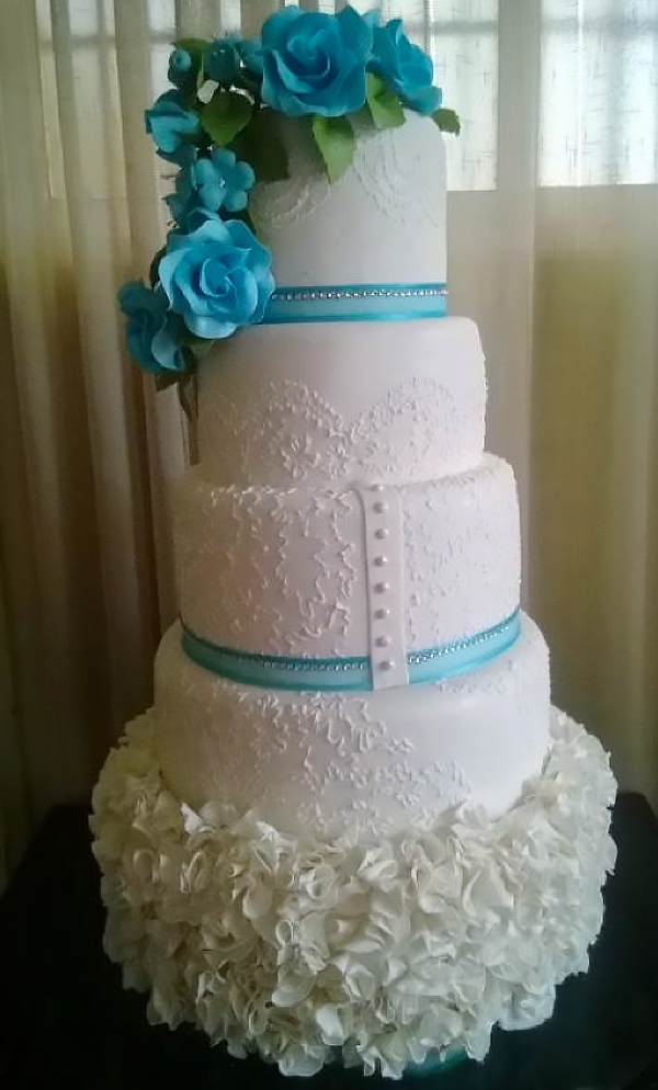 Tiered White Cake Covered with Blue Flowers