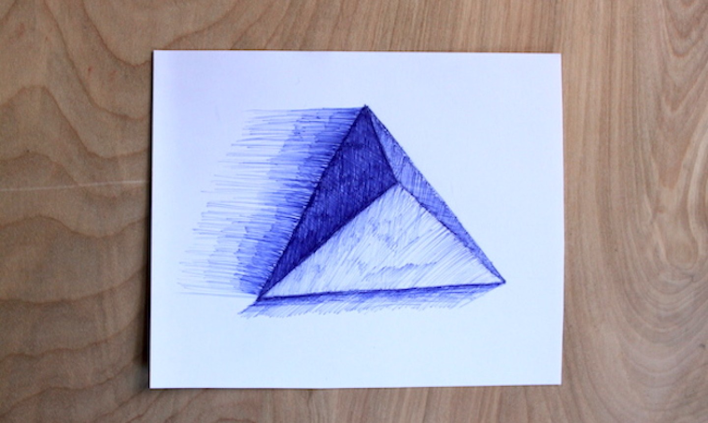 blue pen drawing of triangle