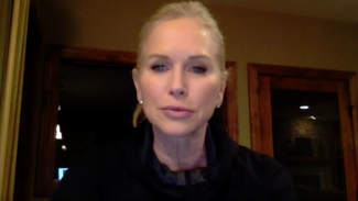 Screenshot of a woman talking on a webcam