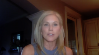 Screenshot of a woman talking on a web cam