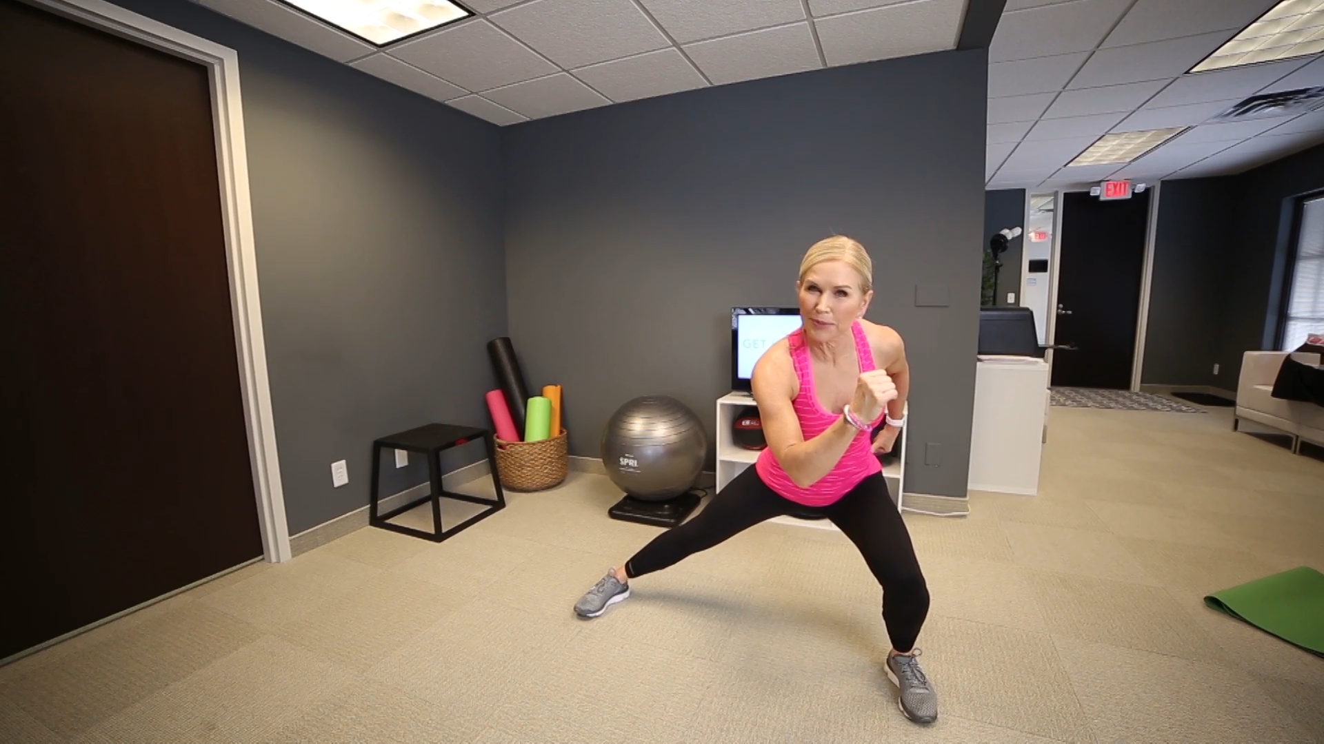 Woman doing a side lunge