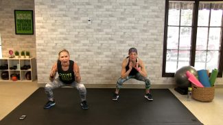 Two women doing squats