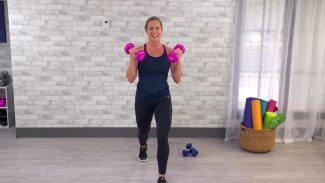 Woman working out with pink dumbbells