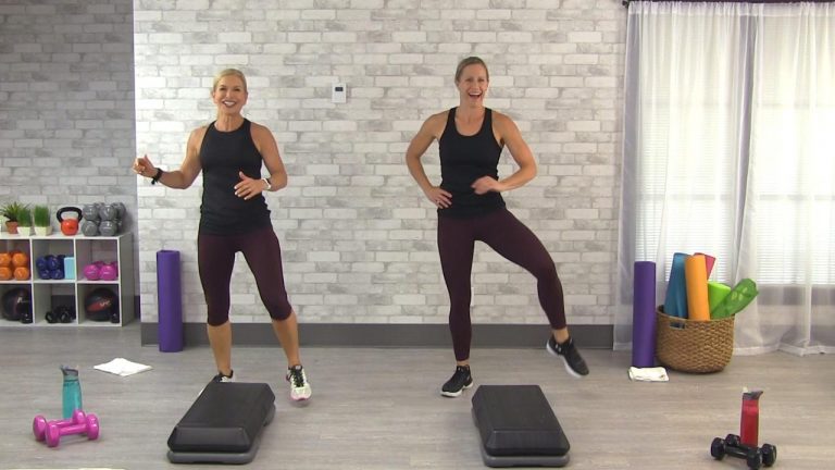 Two women working out with a step