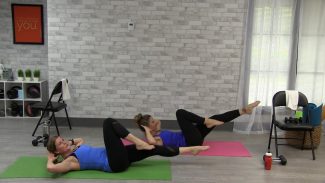 Two women doing a core workout