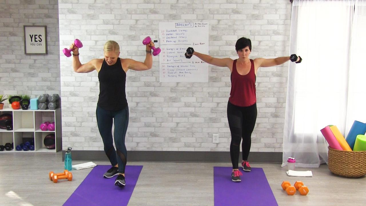 Two women doing lateral flies with dumbbells