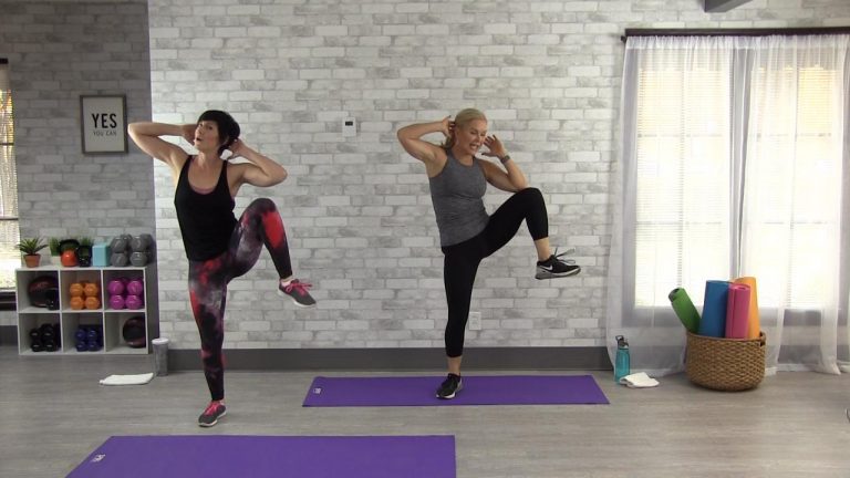 Two women doing side crunches