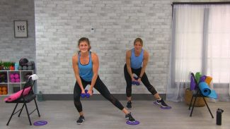 Two women in blue tank tops doing lateral lunges