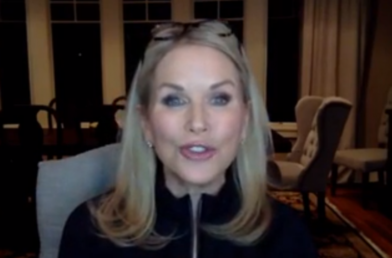 Screenshot of a woman talking on a webcam