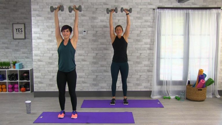 Two women using dumbbells to workout
